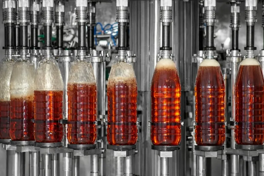 Vinegar bottling line scene with stable filling capping labeling and final packaging